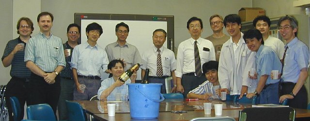 ASTRO-E Integration team celebrating first performance test. (43K JPEG)
