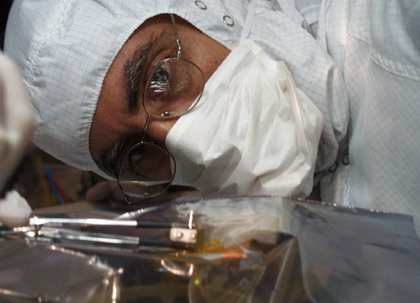 Closeup of Tom in bunny suit, lining things up (51K JPEG)