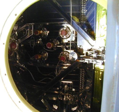 The XRS Dewar slightly visible through a hole (53K JPEG)