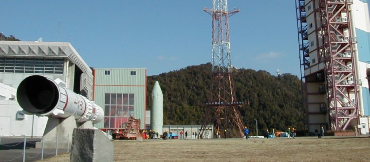 ASTRO-E on the concrete space between assembly building and tower (59K JPEG)