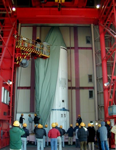 Curtainlike blankets being unzipped from ASTRO-E (50K JPEG)