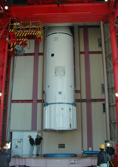 Third stage disappearing up into launch tower. (44K JPEG)