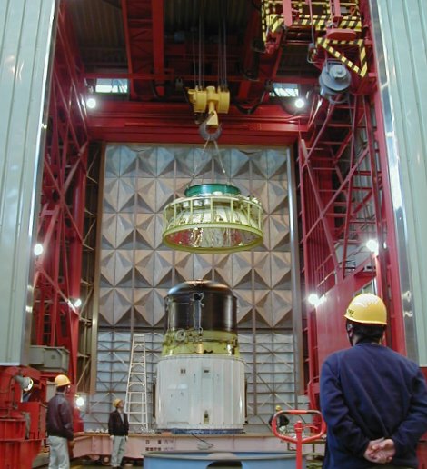 Crane hoisting the top off the third stage (61K JPEG)