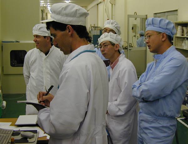 ISAS, GSFC, and SHI people watching the data at SHI (38K JPEG)