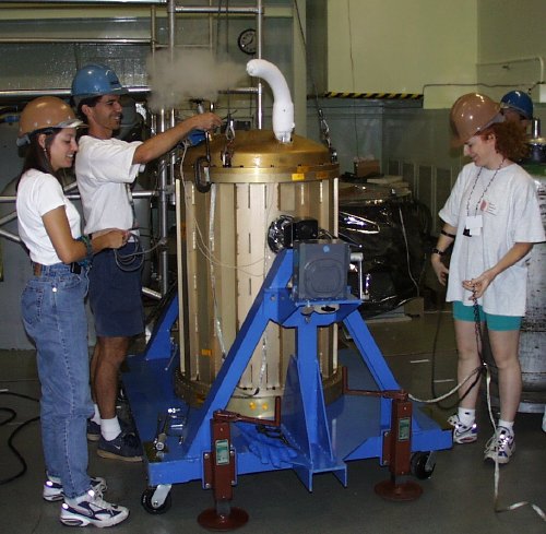 Cold fog billowing from a gold Dewar (62K JPEG)